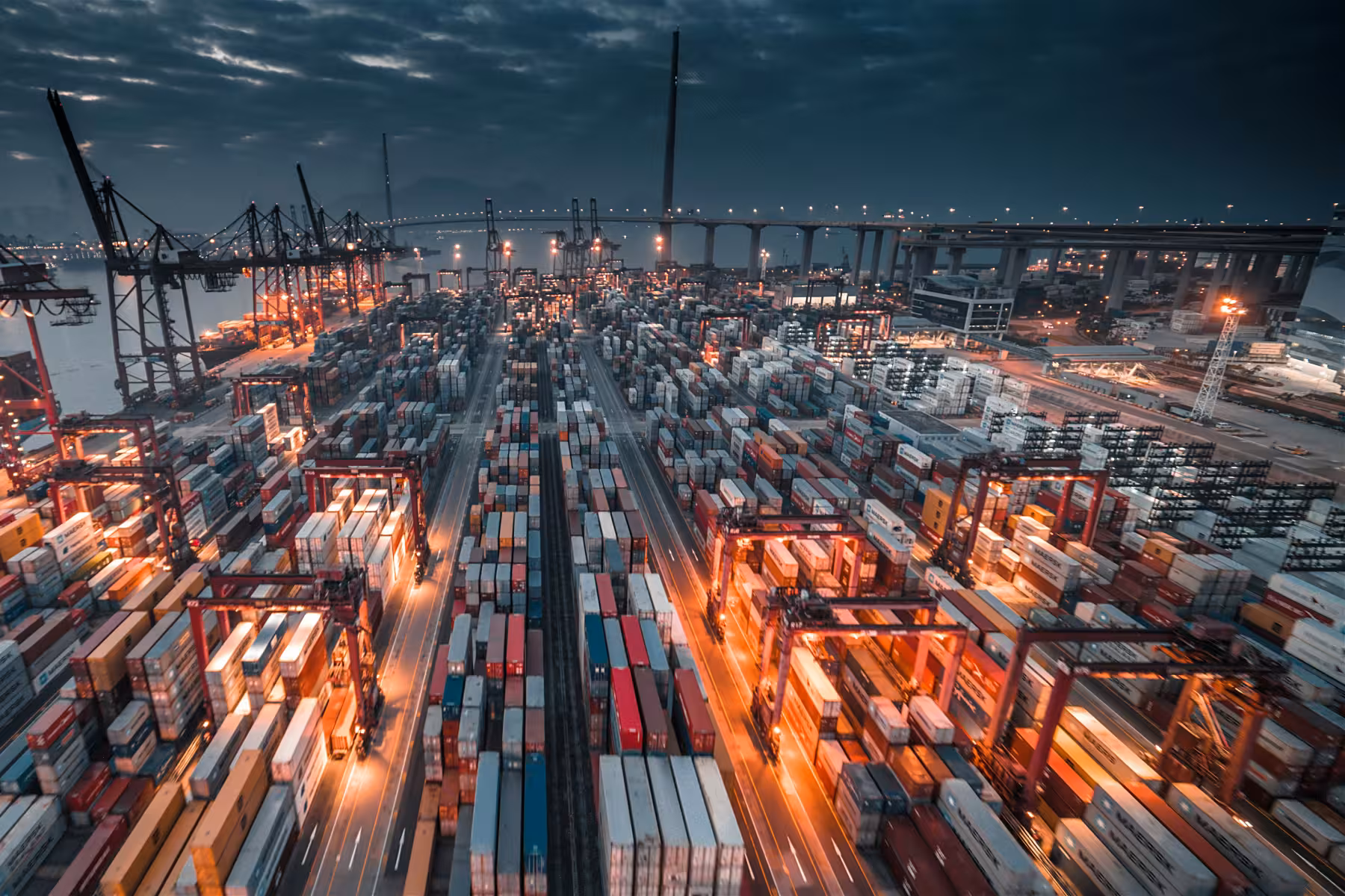 Container ship being loaded by gantry cranes at a port